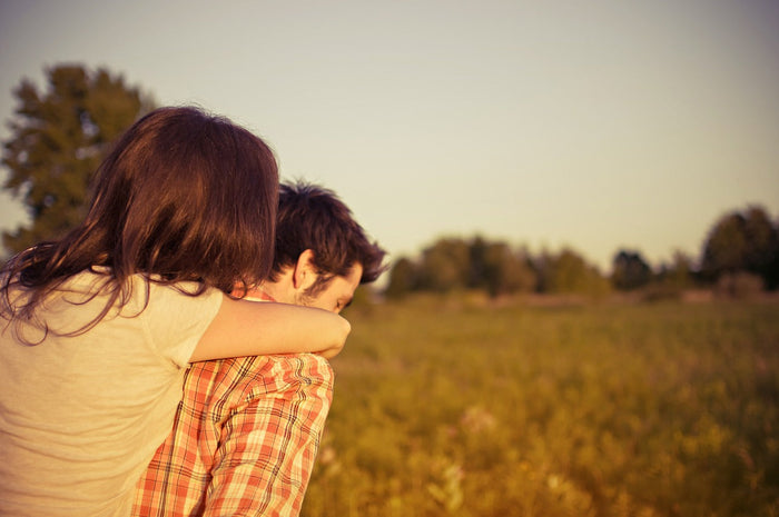 Woman piggybacking on her boyfriend.
