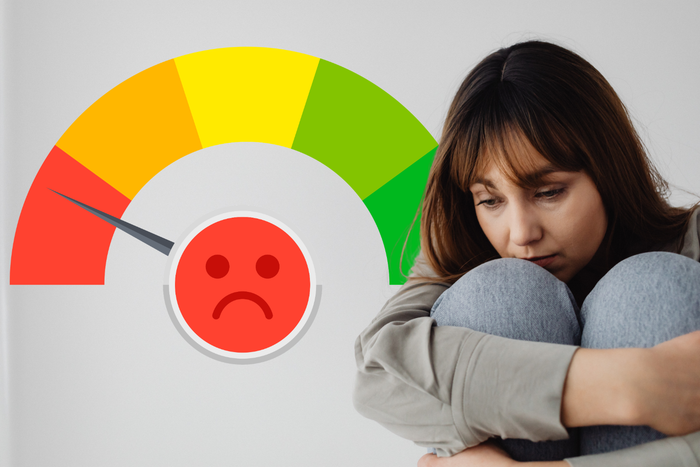 Woman looking overwhelmed beside an emotional intensity gauge, illustrating common reasons for feeling highly emotional.