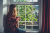 Woman looking out the window.