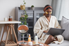 A woman practicing self-care at a wellness retreat.