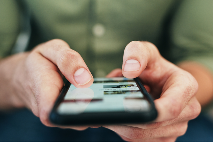Person holding a smartphone.