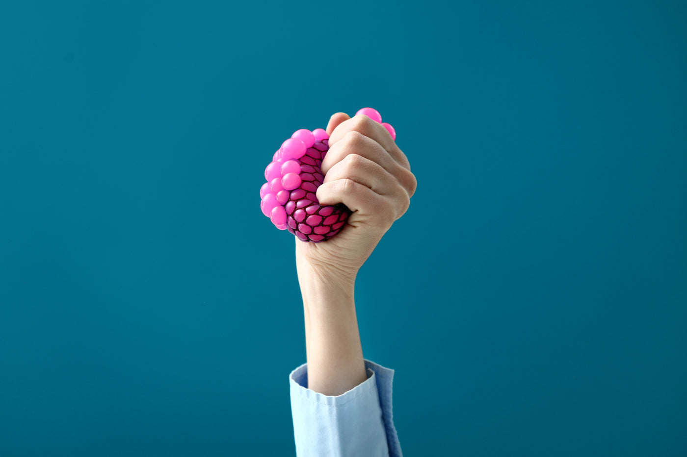 Person holding a stress ball.