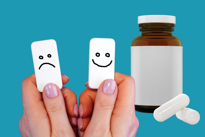 Mood support supplements beside happy and sad face symbols