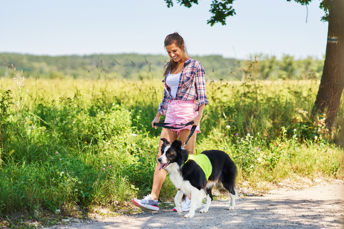 Woman walking her dog.