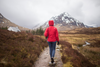 Woman walking on trekking path.