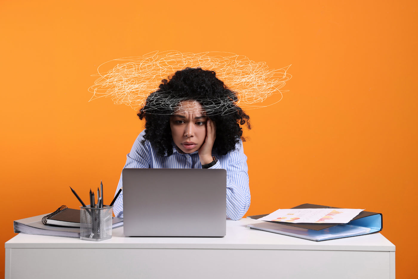 Therapy for burnout illustrated by professional at desk with laptop, charts, and scribble symbol showing stress and overload